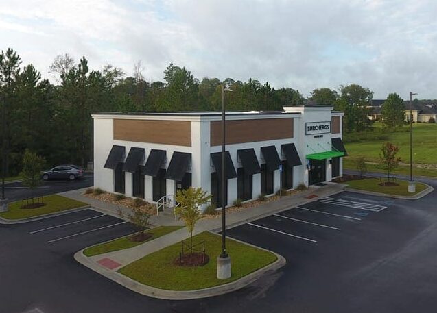 Surcheros restaurant building with landscaped parking lot